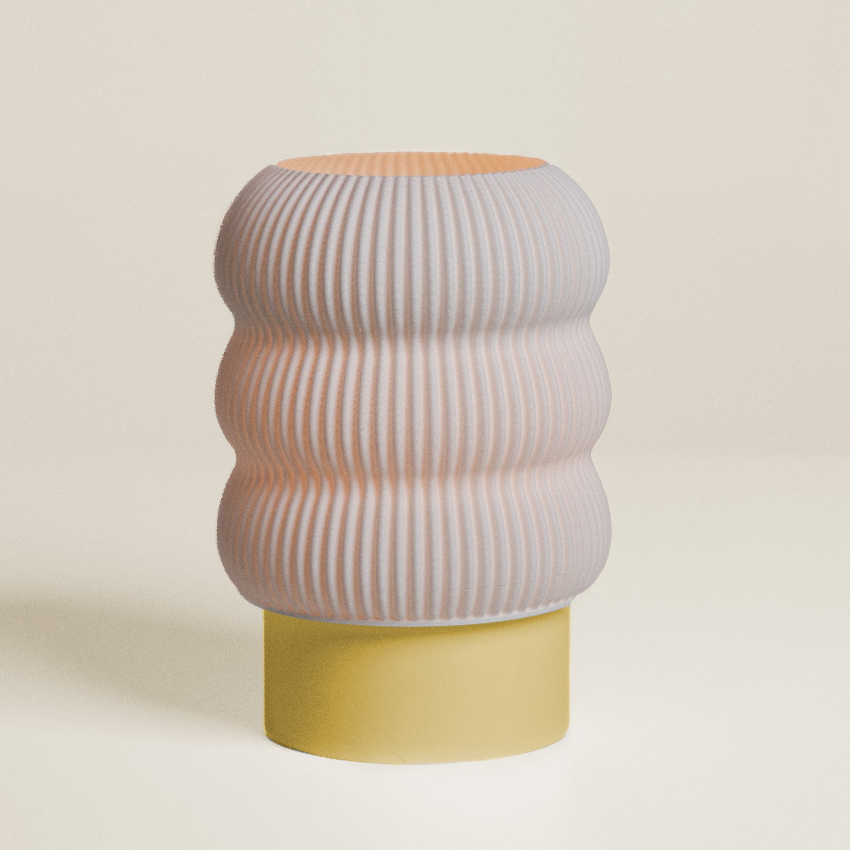 Lola Lamp in Butter – pastel yellow lamp with sculptural lines and a sanded finish
3D printed matte table lamp in soft Butter yellow
Butter Lola Lamp – colorful lighting piece for expressive spaces