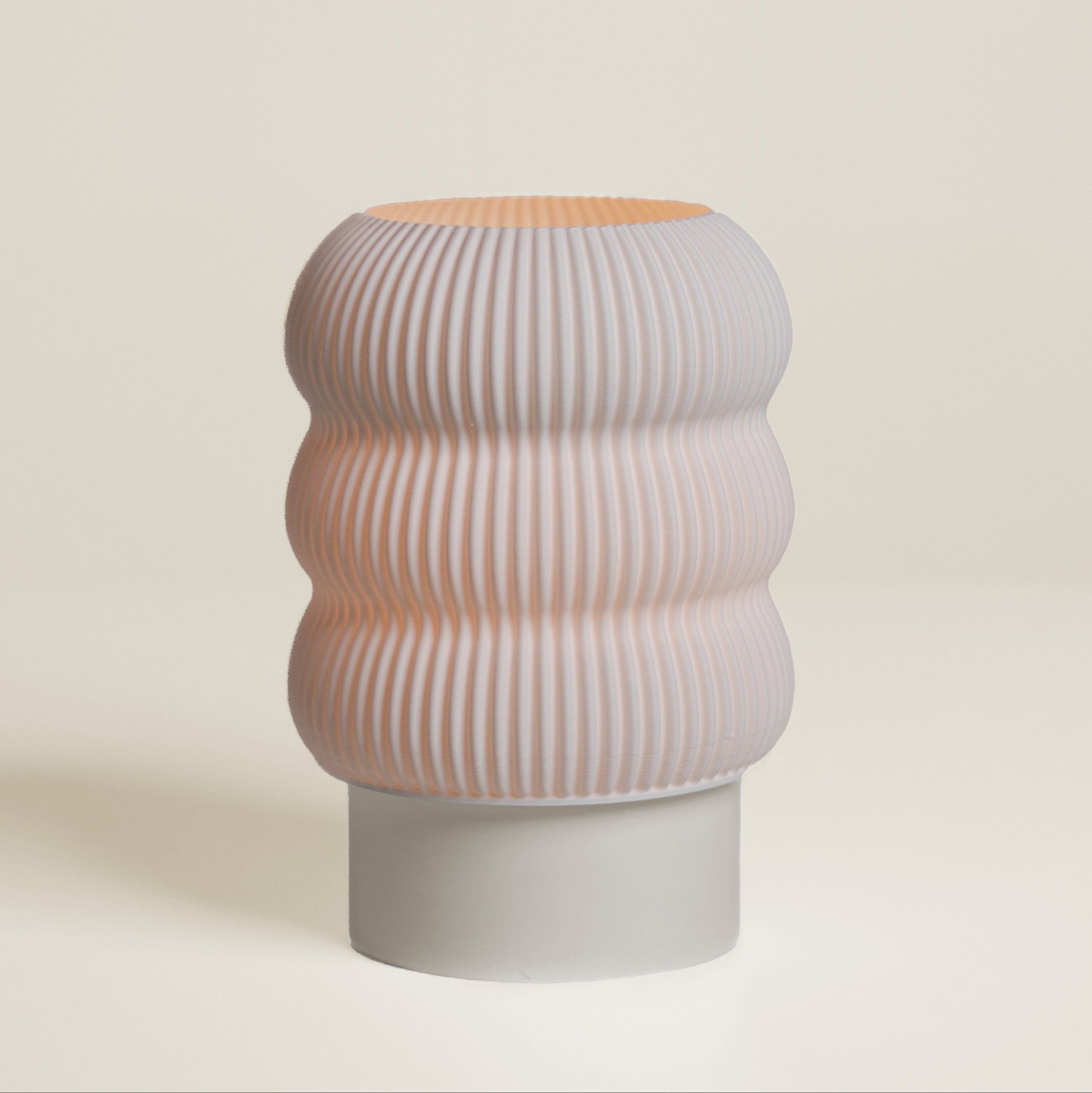Lola Lamp in Cream – sculptural table lamp with soft curves and matte finish
Cream 3D printed table lamp with flared silhouette and smooth texture
Soft white color-block lamp for modern interior spaces