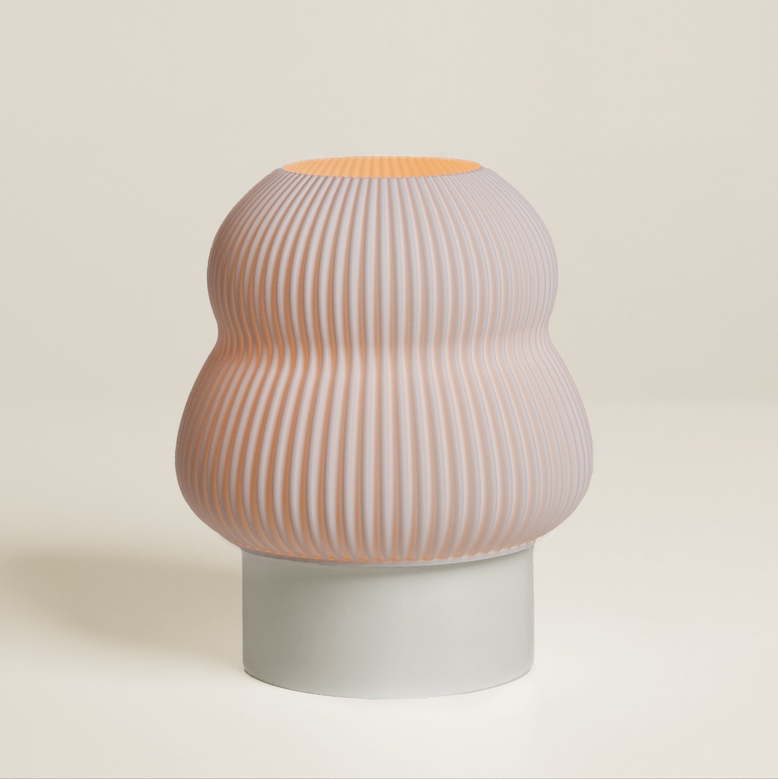 Poly Lamp in Cream– Off white table lamp with a smooth, layered texture
Small matte-finished lamp in Cream for cloud-like vibes
Sculptural bedside lamp in cream for dopamine decor